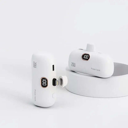 White pocket wireless capsule power bank with LED display, showing fast charging capabilities and compact design for portability