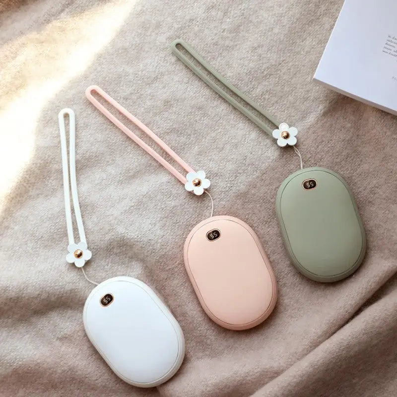 Mini Power Bank - Compact and Portable Charger in White, Pink, and Green Colors with Flower Straps on Beige Background